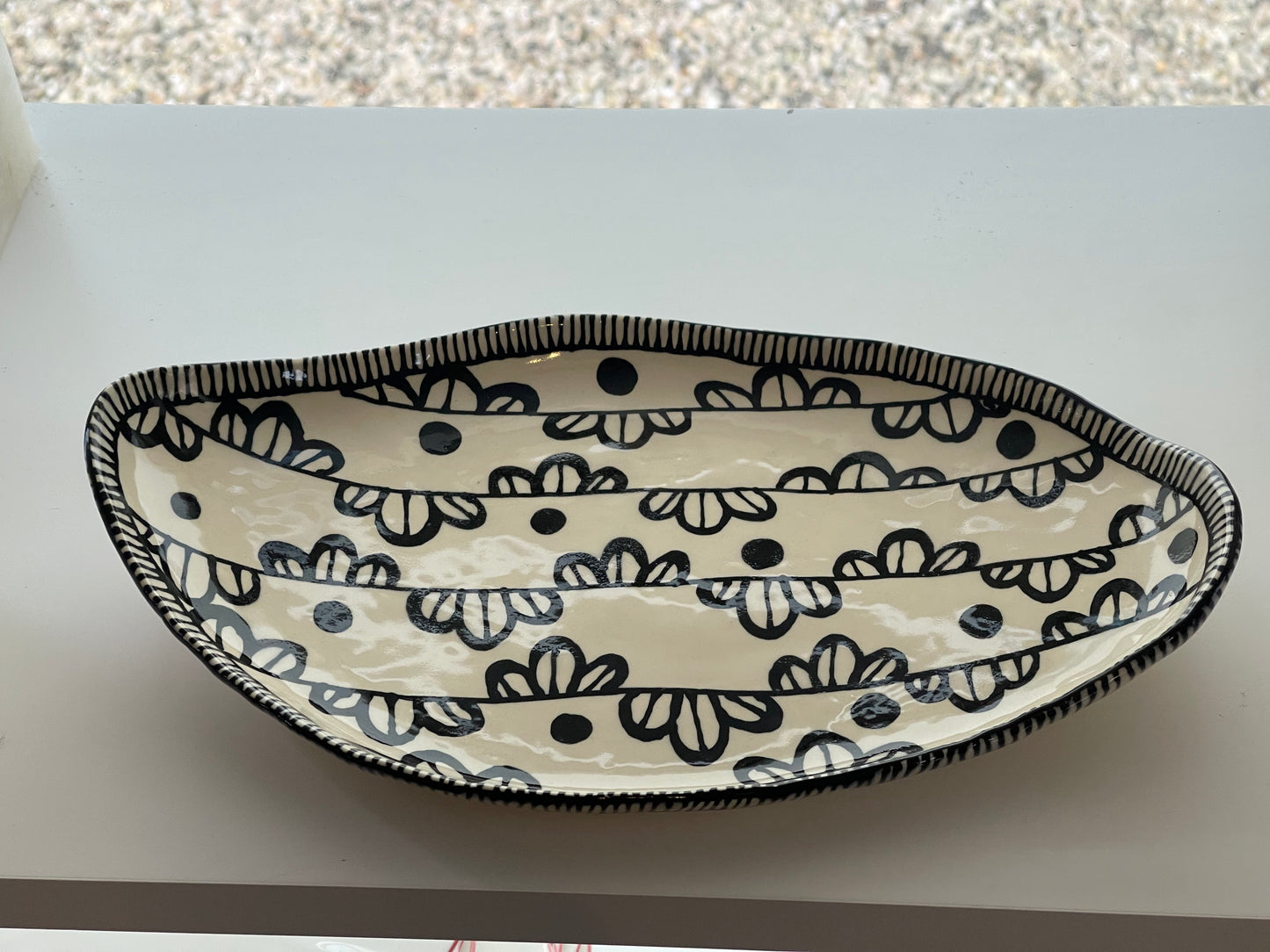 Handmade Black Freeform Pottery Dish with black design around the rim