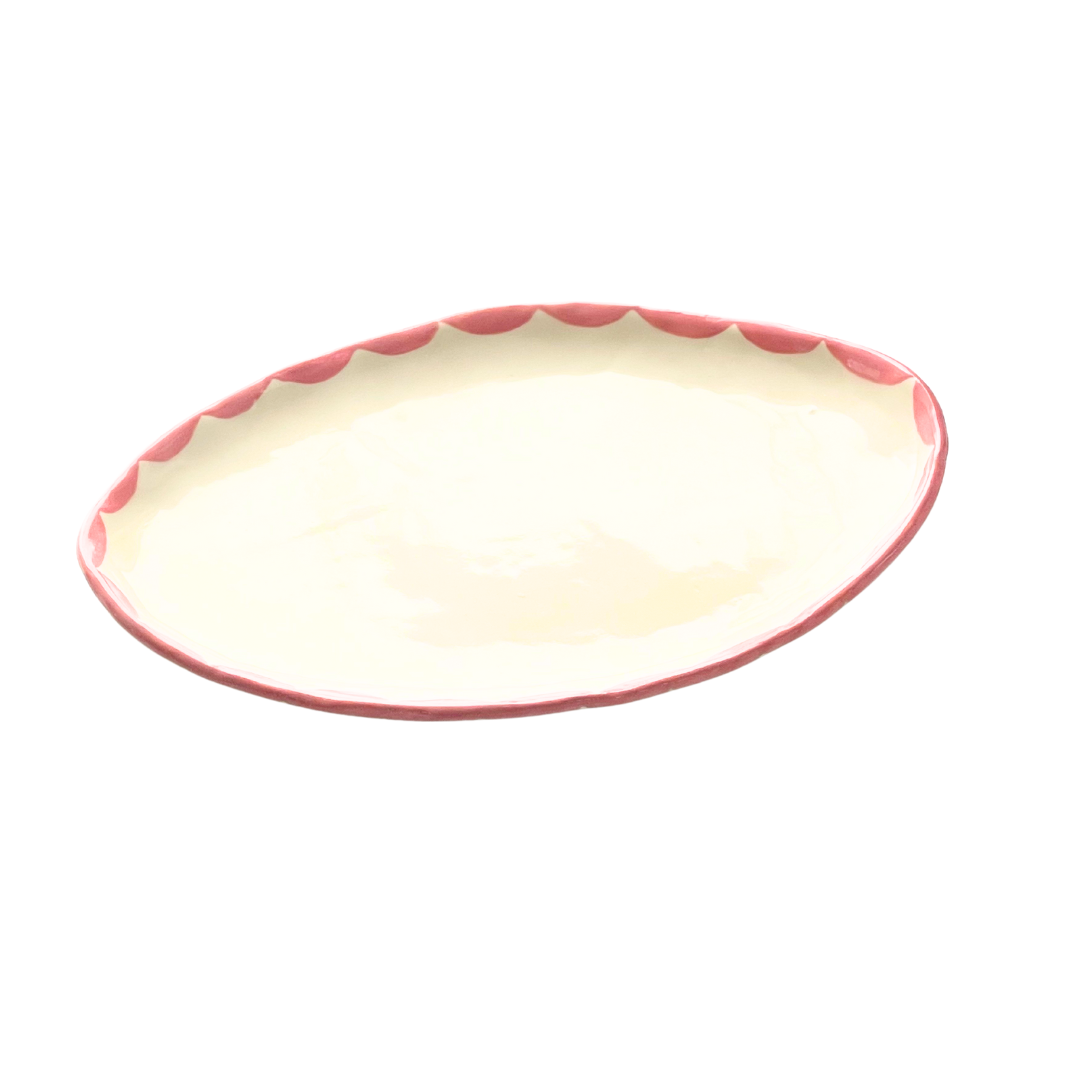 Handmade Pink Freeform Pottery Dish with pink design around the rim